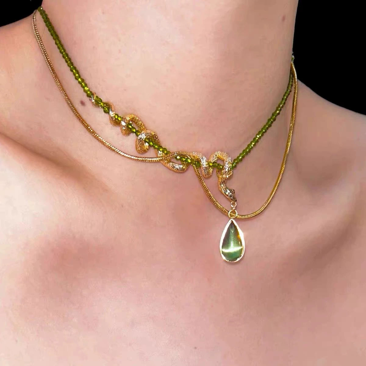 Thalia- Pear Cut Green Peridot Unique Serpent Shape Necklace