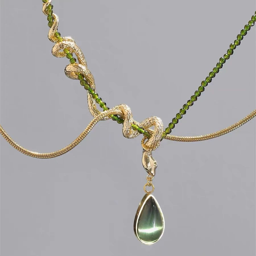 Thalia- Pear Cut Green Peridot Unique Serpent Shape Necklace