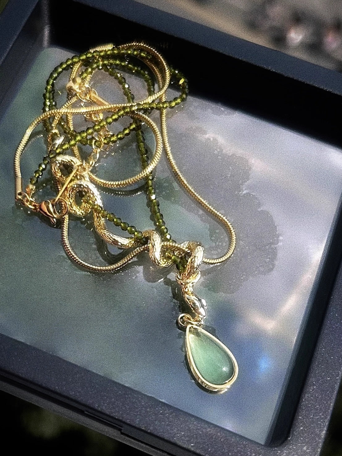 Thalia- Pear Cut Green Peridot Unique Serpent Shape Necklace