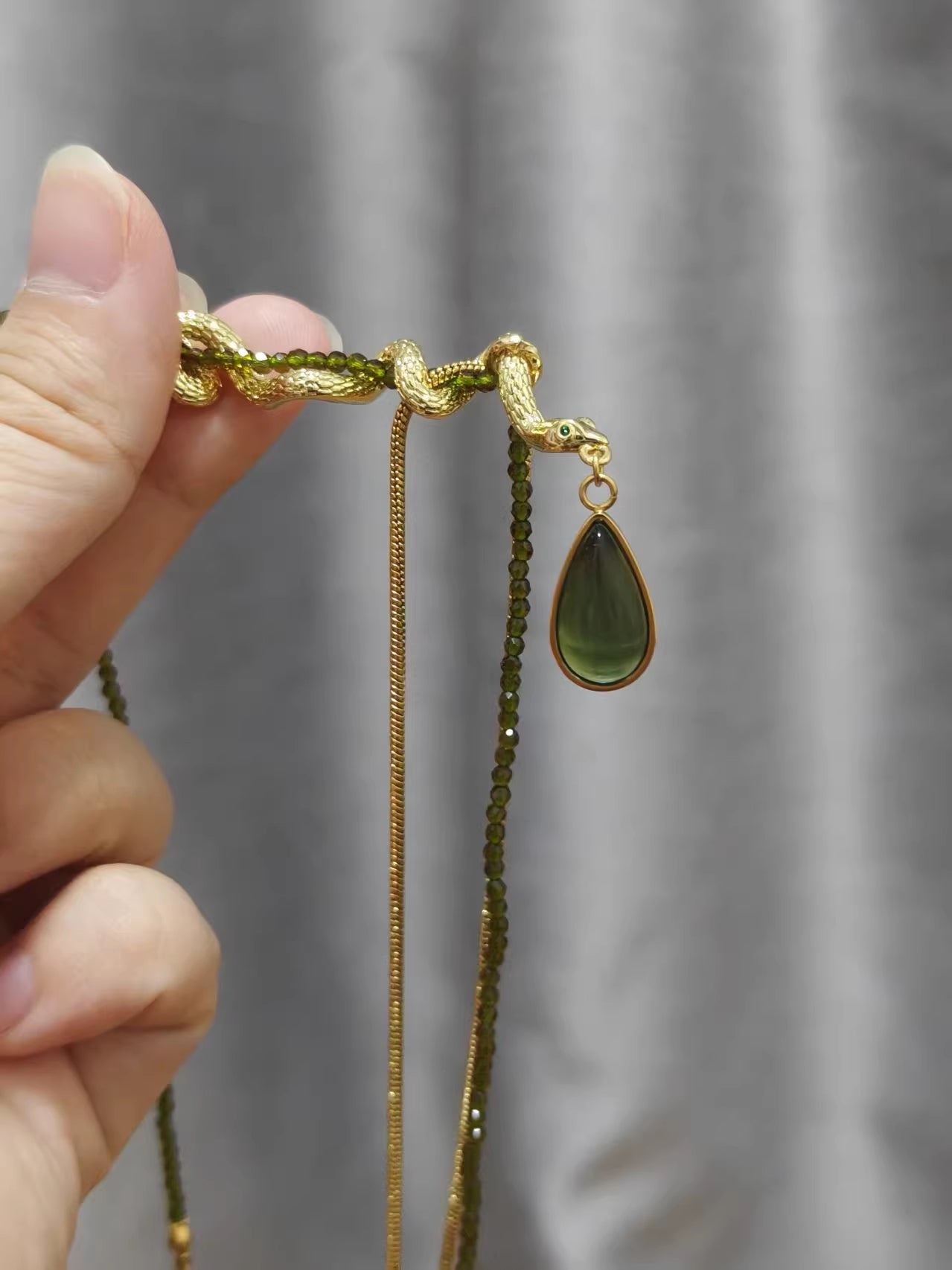 Thalia- Pear Cut Green Peridot Unique Serpent Shape Necklace
